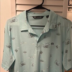 Travis Mathew Blue Polo Shirt with Playful Pattern